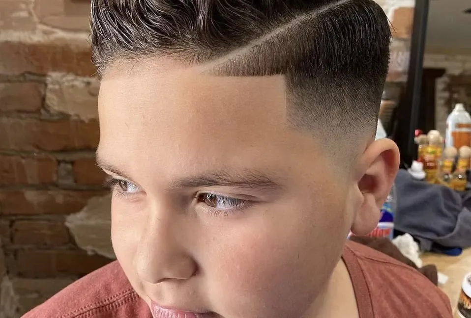 Hard part combover with skin fade at Dads Barber Shop